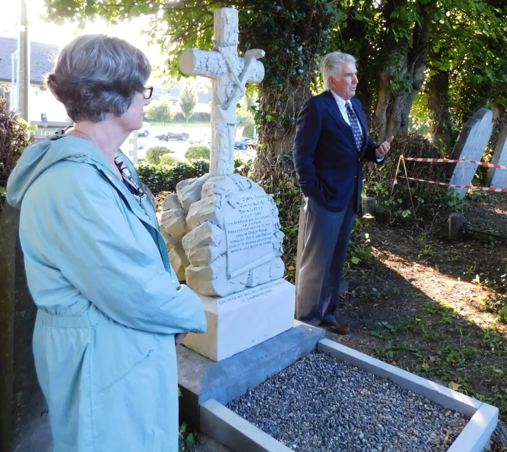 Darby Ryan; Claire Grogan Williams and her brother John Grogan at the grave of Darby Ryan at Bansha Old Cemetery