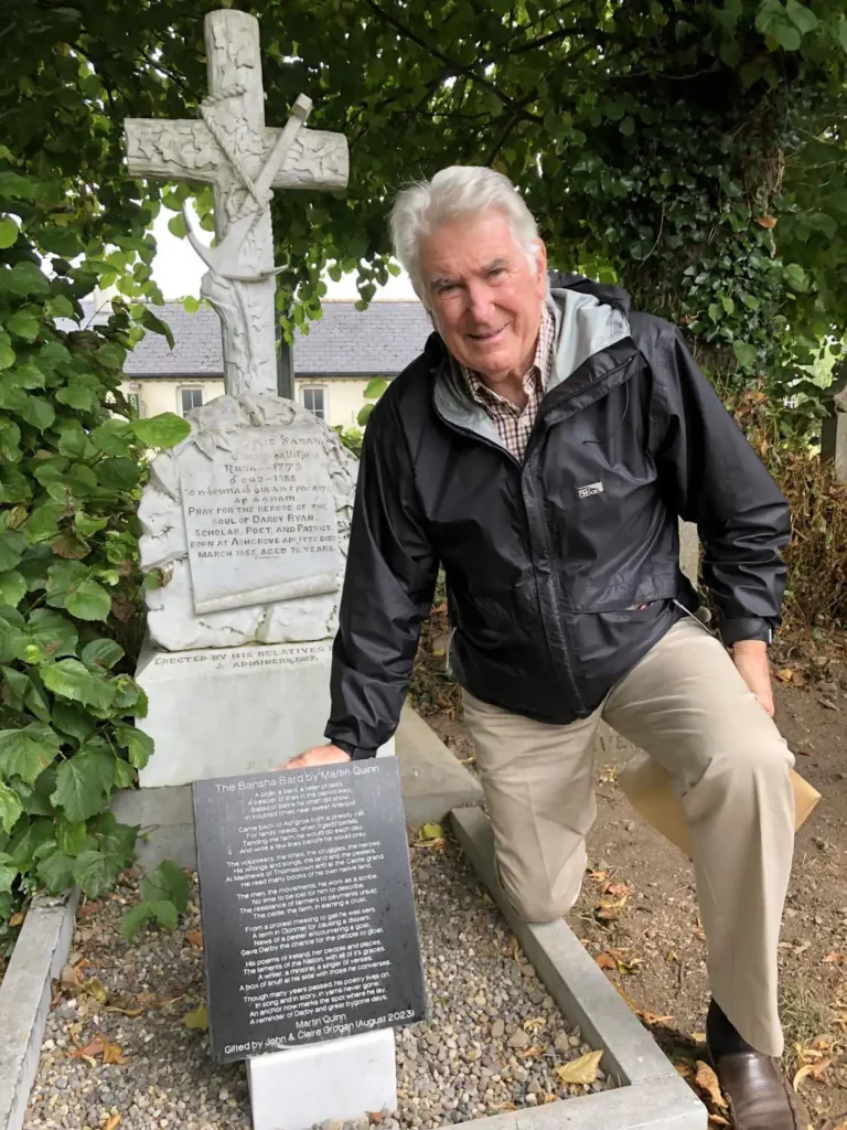 John Grogan, at the grave of Darby Ryan with the recenly added poem, which was composed by Martin Quinn